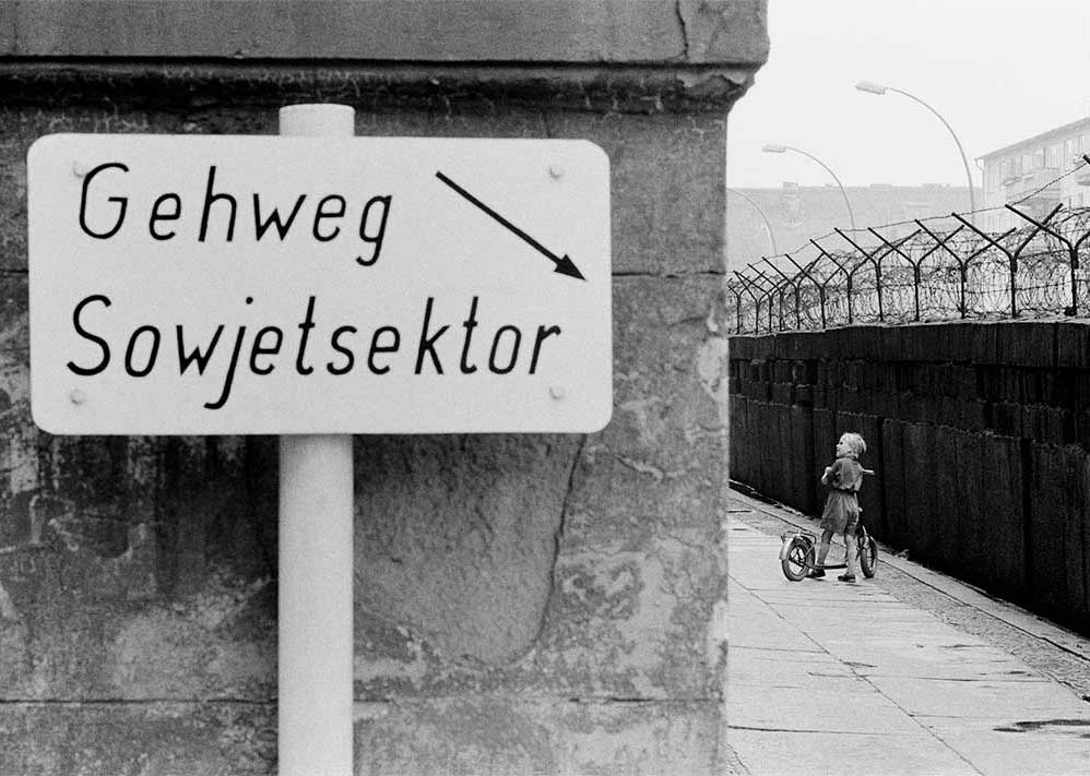 THoepker Child with Scooter at the Berlin Wall